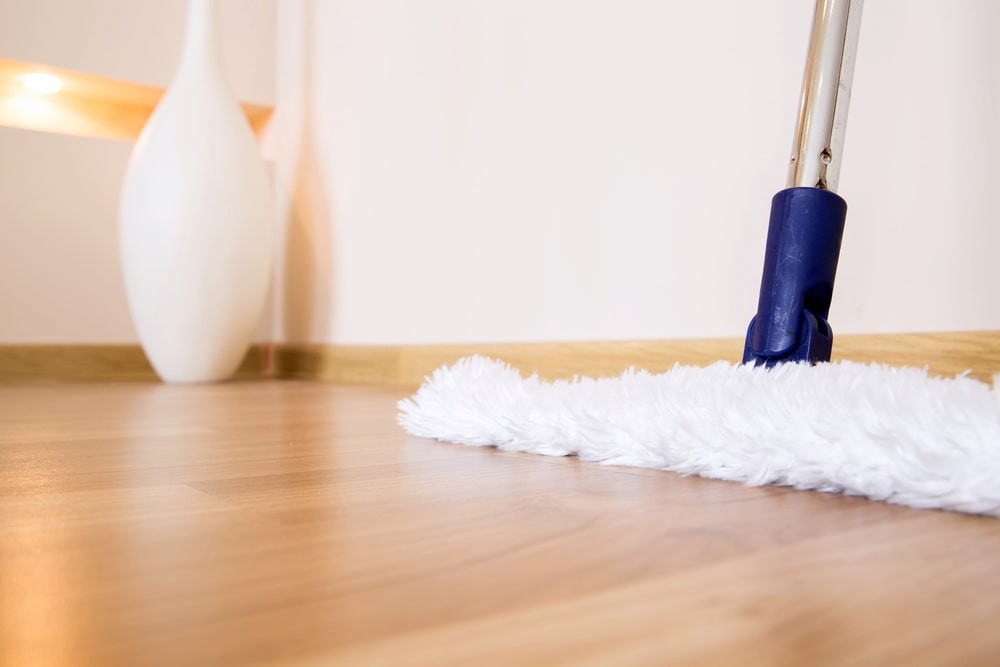 A mop cleaning hardwood floors